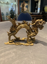 A pair of Chinese gilt bronze dragons among flames and clouds, 19/20th C.