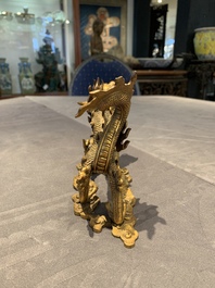 A pair of Chinese gilt bronze dragons among flames and clouds, 19/20th C.