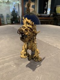 A pair of Chinese gilt bronze dragons among flames and clouds, 19/20th C.