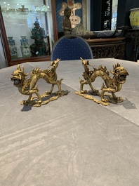 A pair of Chinese gilt bronze dragons among flames and clouds, 19/20th C.
