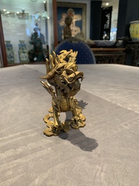 A pair of Chinese gilt bronze dragons among flames and clouds, 19/20th C.
