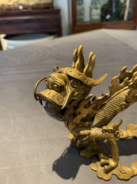 A pair of Chinese gilt bronze dragons among flames and clouds, 19/20th C.