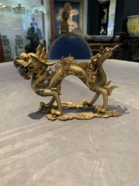 A pair of Chinese gilt bronze dragons among flames and clouds, 19/20th C.