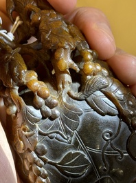 A rare Chinese carved rhinoceros horn 'libation cup' with grape design, 17/18th C.
