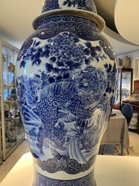 A massive Japanese blue and white Arita vase and cover with an eagle, a shishi and cub, 19th C.