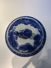 A massive Japanese blue and white Arita vase and cover with an eagle, a shishi and cub, 19th C.