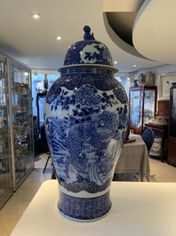 A massive Japanese blue and white Arita vase and cover with an eagle, a shishi and cub, 19th C.