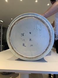 A massive Japanese blue and white Arita vase and cover with an eagle, a shishi and cub, 19th C.
