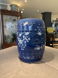 A pair of Chinese white slip-decorated blue-ground garden seats, 19th C.