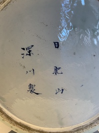 A massive Japanese blue and white Arita vase and cover with an eagle, a shishi and cub, 19th C.