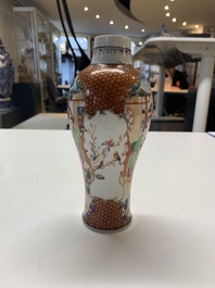 A Chinese famille rose 'mandarin subject' garniture of three vases, Qianlong