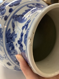 A pair of Chinese blue and white vases and covers with figural panels, 19th C.