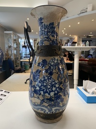 A pair of Chinese Nanking blue and white crackle-glazed 'phoenix' vases, 19th C.