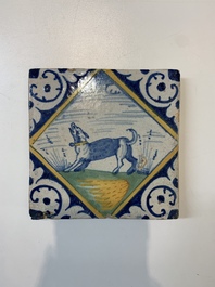 A polychrome Dutch Delft maiolica 'diamond' 'dog' tile, late 16th C.