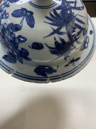 A pair of Chinese blue and white vases and covers with figural panels, 19th C.