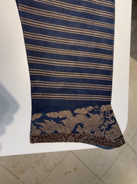 A Chinese embroidered silk blue-ground summer gauze 'nine dragons' robe, 19th C.