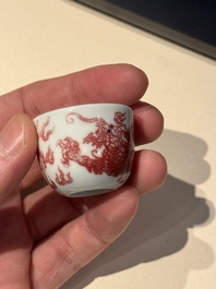 A small Chinese blue, white and copper-red 'dragon' wine cup, Lang Jin Ge Zhi 郎唫閣製 mark, 19/20th C.