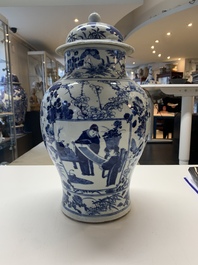 A pair of Chinese blue and white vases and covers with figural panels, 19th C.