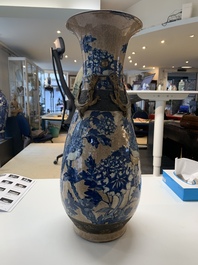 A pair of Chinese Nanking blue and white crackle-glazed 'phoenix' vases, 19th C.