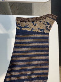 A Chinese embroidered silk blue-ground summer gauze 'nine dragons' robe, 19th C.