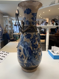 A pair of Chinese Nanking blue and white crackle-glazed 'phoenix' vases, 19th C.