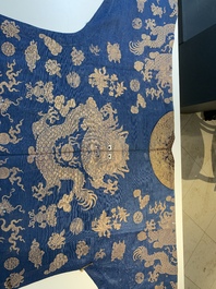 A Chinese embroidered silk blue-ground summer gauze 'nine dragons' robe, 19th C.