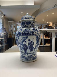 A pair of Chinese blue and white vases and covers with figural panels, 19th C.