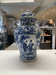 A pair of Chinese blue and white vases and covers with figural panels, 19th C.