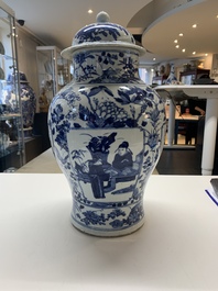A pair of Chinese blue and white vases and covers with figural panels, 19th C.