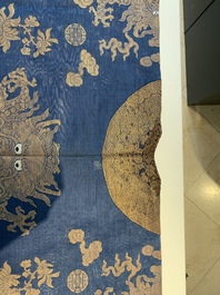 A Chinese embroidered silk blue-ground summer gauze 'nine dragons' robe, 19th C.