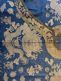 A Chinese embroidered silk blue-ground summer gauze 'nine dragons' robe, 19th C.