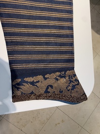 A Chinese embroidered silk blue-ground summer gauze 'nine dragons' robe, 19th C.