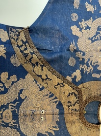 A Chinese embroidered silk blue-ground summer gauze 'nine dragons' robe, 19th C.
