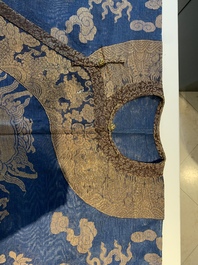 A Chinese embroidered silk blue-ground summer gauze 'nine dragons' robe, 19th C.