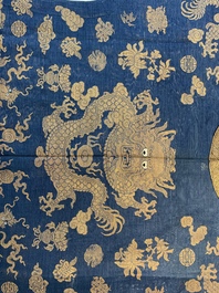 A Chinese embroidered silk blue-ground summer gauze 'nine dragons' robe, 19th C.