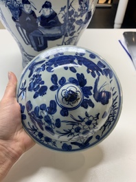 A pair of Chinese blue and white vases and covers with figural panels, 19th C.