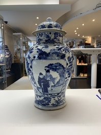 A pair of Chinese blue and white vases and covers with figural panels, 19th C.