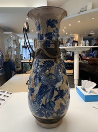 A pair of Chinese Nanking blue and white crackle-glazed 'phoenix' vases, 19th C.