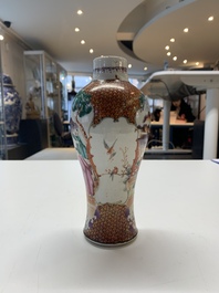 A Chinese famille rose 'mandarin subject' garniture of three vases, Qianlong