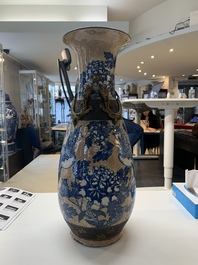A pair of Chinese Nanking blue and white crackle-glazed 'phoenix' vases, 19th C.