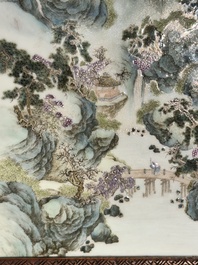 A large Chinese carved wooden table screen with a fine famille rose 'landscape' plaque, 19th C.