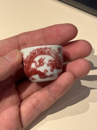 A small Chinese blue, white and copper-red 'dragon' wine cup, Lang Jin Ge Zhi 郎唫閣製 mark, 19/20th C.