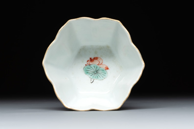 A fine Chinese famille verte 'boy and lotus' flower-shaped cup and a wooden stand, Kangxi