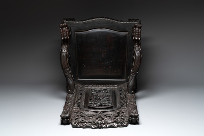 A Chinese richly carved and lacquered hongmu armchair, Canton, 19th C.