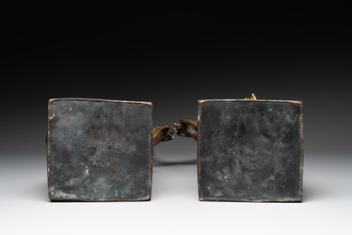 A pair of large Chinese gilt bronze offering figures on stand, 19th C.
