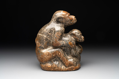 A Chinese stone group of two monkeys, 20th C.