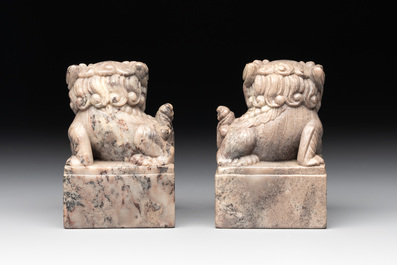 A pair of Chinese grey marble 'lion' seals and a seal, 20th C.