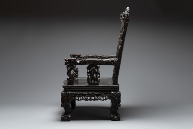 A Chinese richly carved and lacquered hongmu armchair, Canton, 19th C.