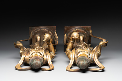 A pair of large Chinese gilt bronze offering figures on stand, 19th C.