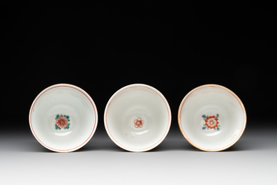 A set of 12 Chinese famille verte cups and saucers with floral design, Kangxi
